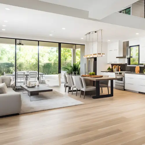 Sydney open-plan living renovation – WizBuilt modern open-plan living and kitchen renovation with light timber flooring in a Sydney home