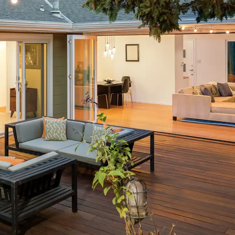 Modern timber deck with outdoor seating and open-plan living area