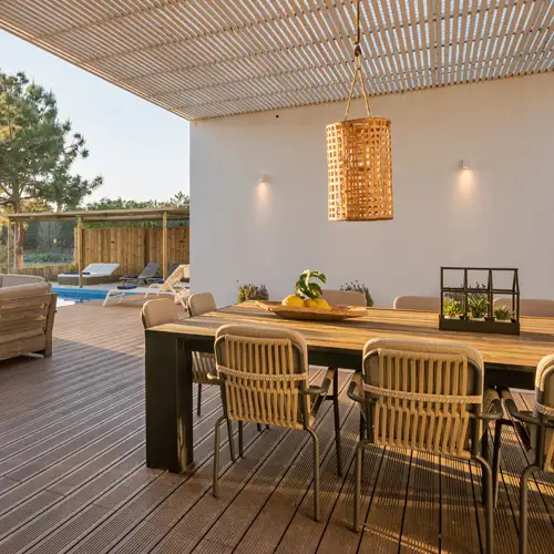 Sydney outdoor decking and living renovation – WizBuilt modern outdoor living area with timber deck, pergola roof and dining setting in a renovated Sydney home