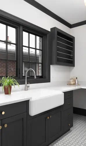 Sydney laundry renovation – WizBuilt modern Sydney laundry renovation with farmhouse sink, black cabinetry and hexagon floor tiles